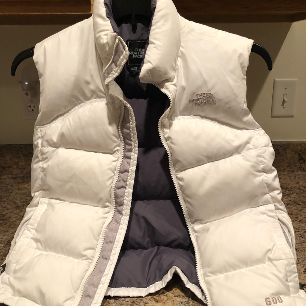 Girl’s North Face white puffer vest.